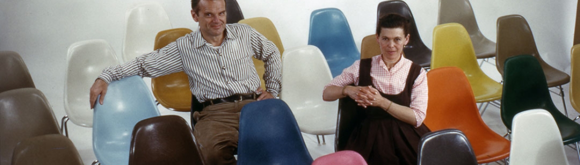 Portrait of Charles and Ray Eames sitting on the Eames Shell Chair