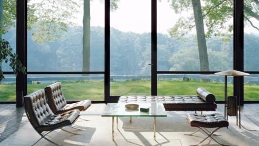 Barcelona chairs in sunlit living room