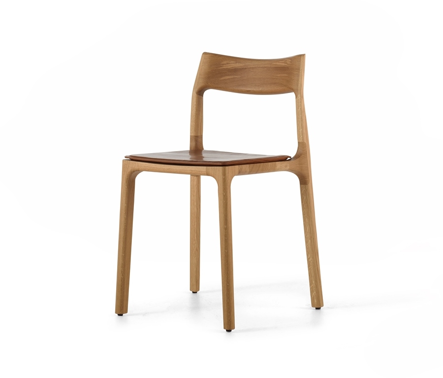 Molloy dining chair with seat pad Molloy dining chair designed by Adam Goodrum